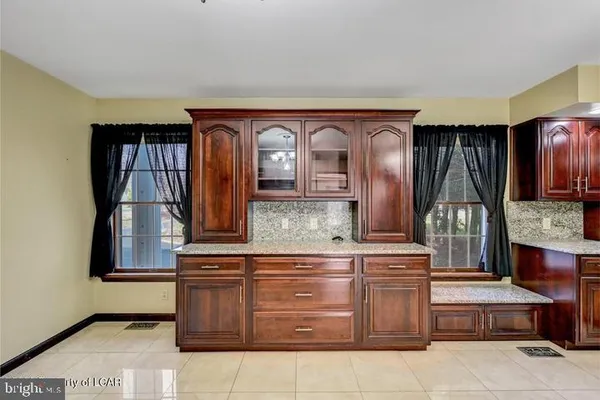 a view of a livingroom with an empty space and hallway
