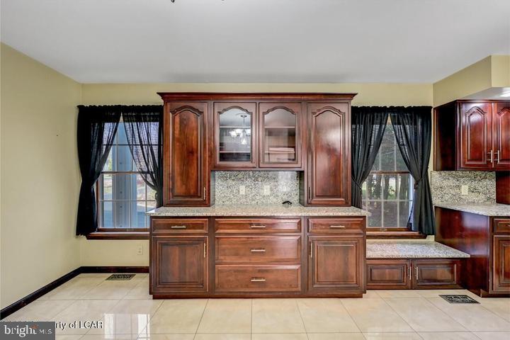 1424 East Broad Street Hazleton, PA 18201 - Photo 26 of 89 a bathroom with a granite countertop sink and a mirror