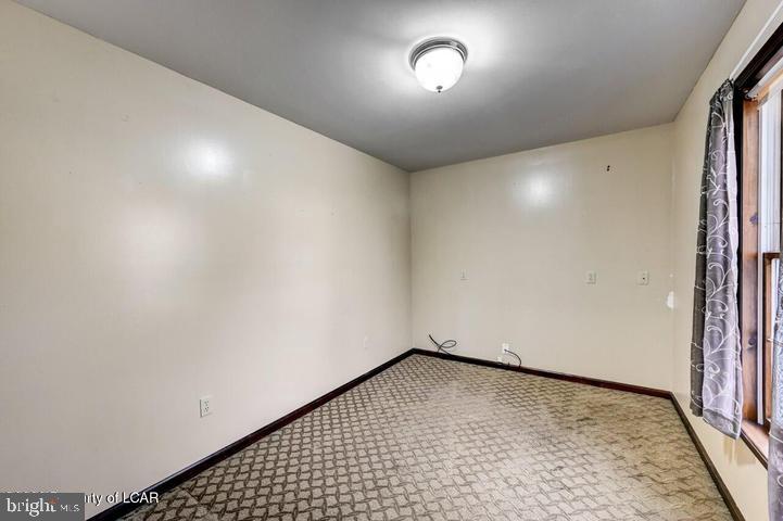 1424 East Broad Street Hazleton, PA 18201 - Photo 29 of 89 an empty room with a bench and a window