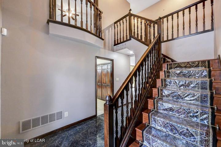 1424 East Broad Street Hazleton, PA 18201 - Photo 33 of 89 a view of staircase with railing and a chandelier
