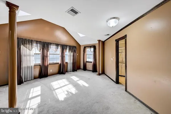 a view of a livingroom with furniture and a window