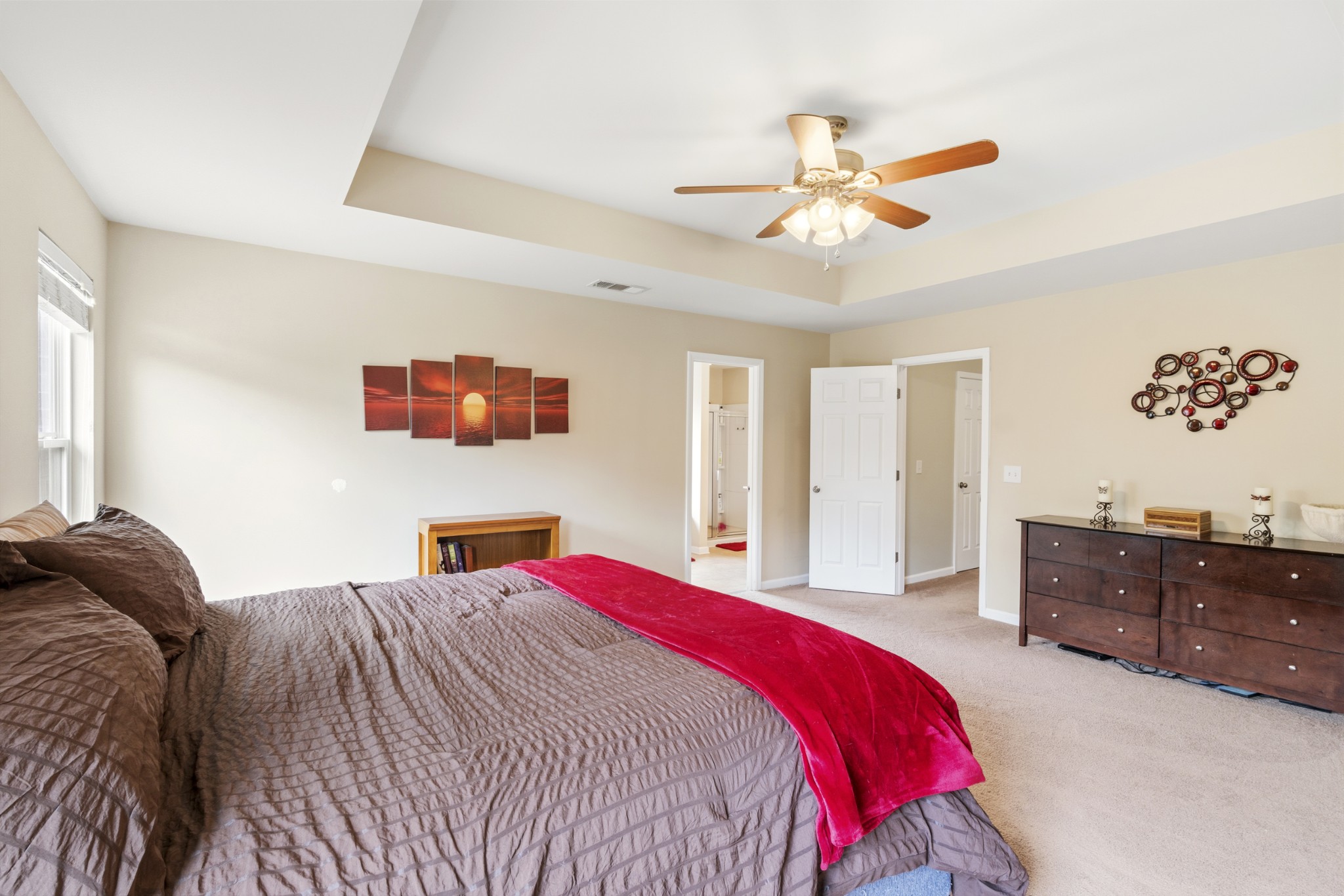 1011 Benwick Road Hendersonville, TN 37075 - Photo 28 of 60 a bedroom with a bed and a chandelier