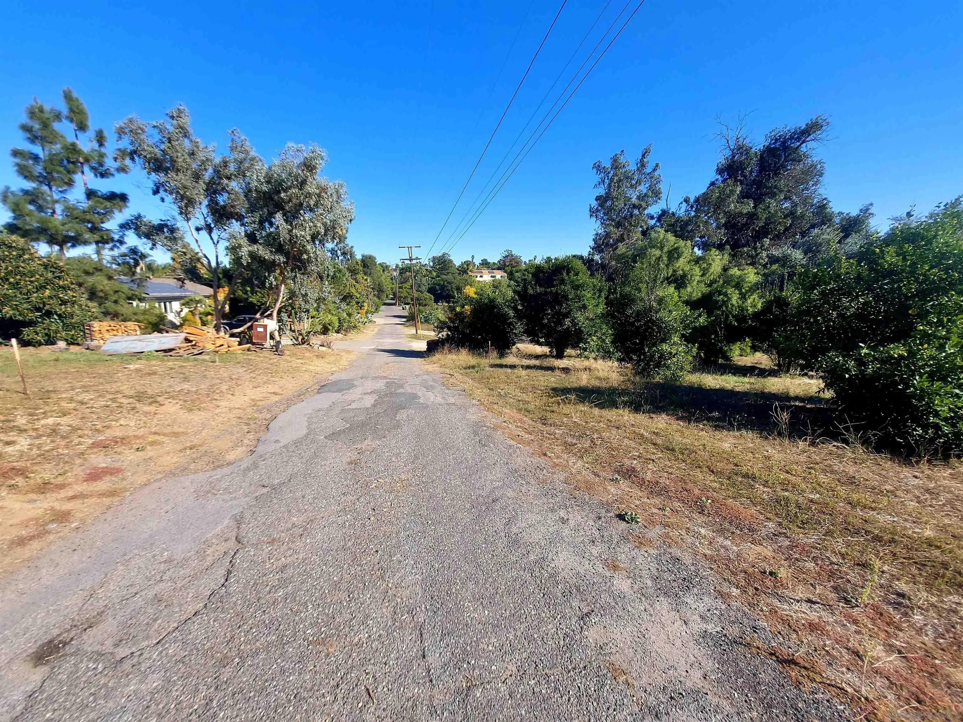 730 Constant Creek Road, Unit 1060117500 Fallbrook, CA 92028 - Photo 13 of 22 a view of a dirt road with a building in the background