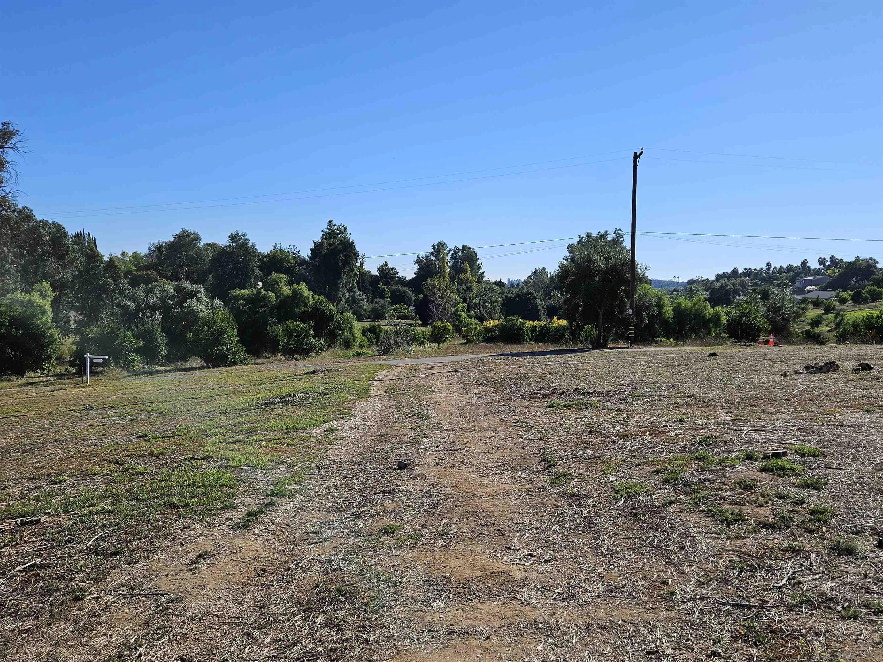 730 Constant Creek Road, Unit 1060117500 Fallbrook, CA 92028 - Photo 4 of 22 a view of a field with trees in background