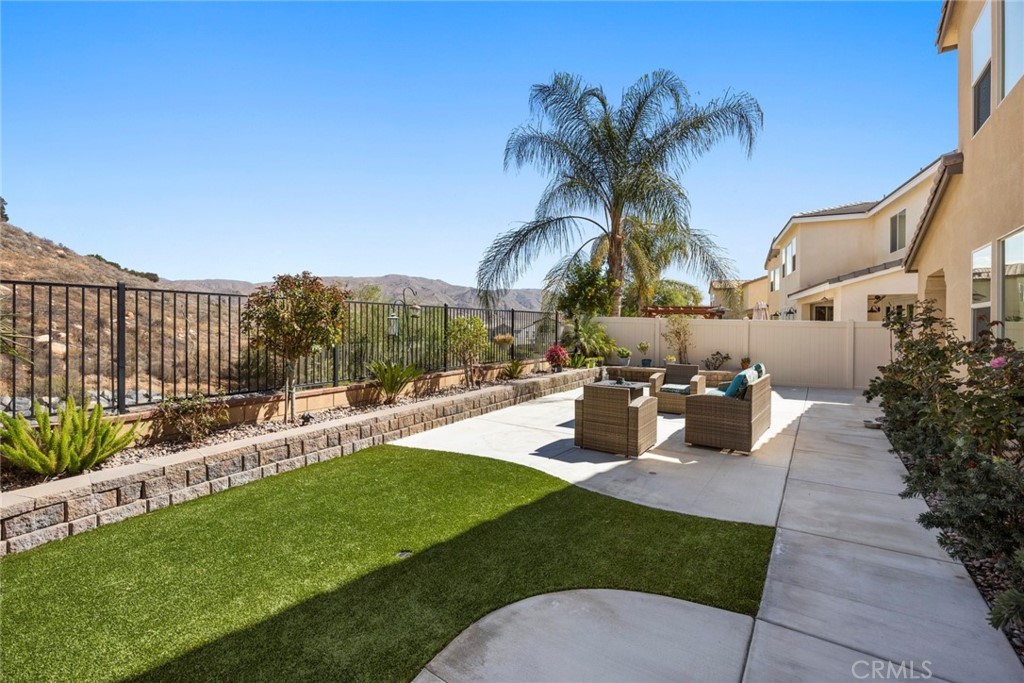 11386 Hutton Road Corona, CA 92883 - Photo 1 of 1 a view of a house with a yard and sitting area