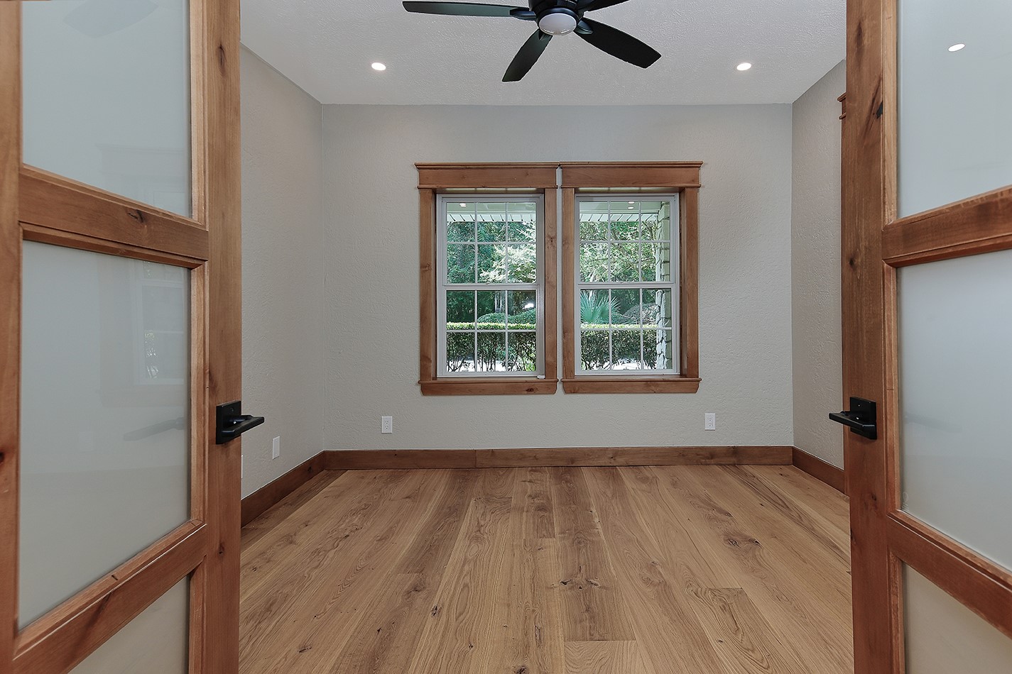 26442 McDonald Road Spring, TX 77380 - Photo 11 of 43 a view of an empty room with a window and wooden floor