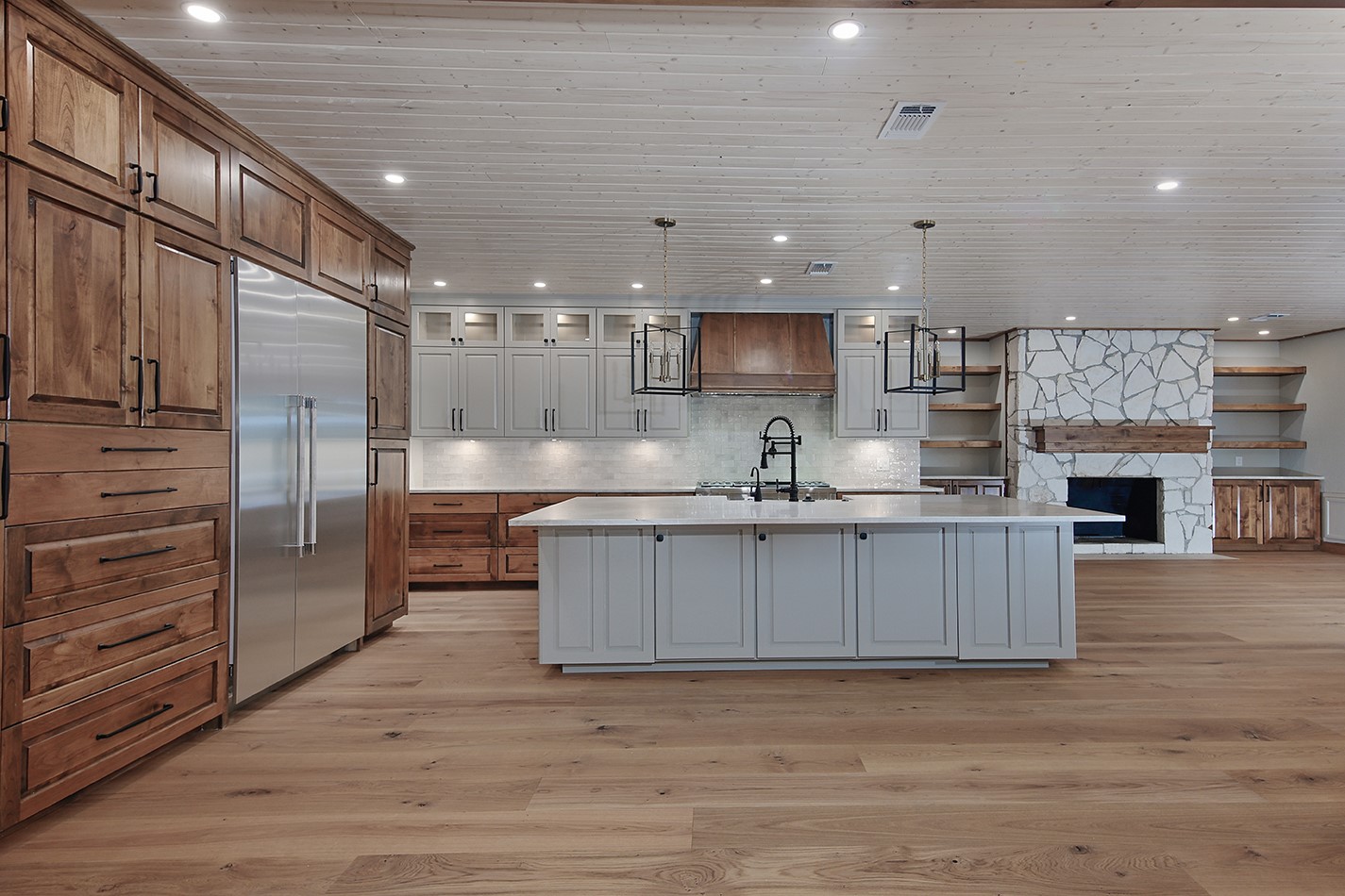 26442 McDonald Road Spring, TX 77380 - Photo 12 of 43 a kitchen with stainless steel appliances granite countertop a sink refrigerator and cabinets