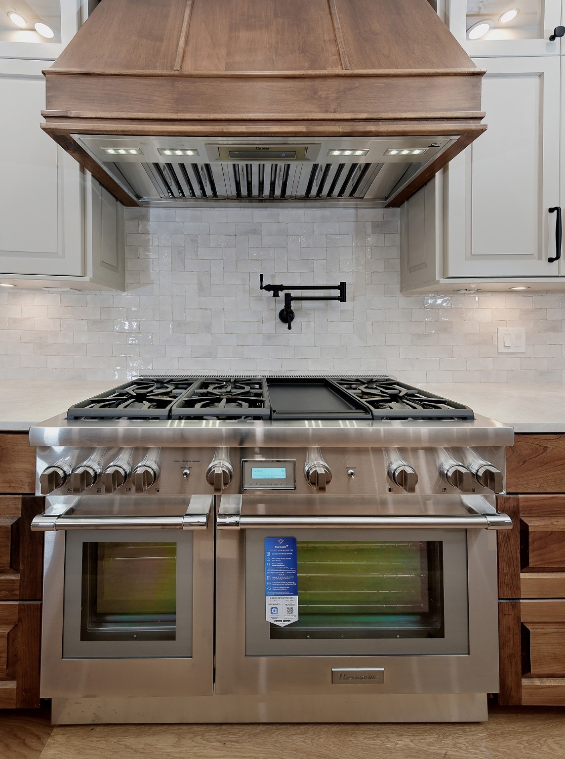 26442 McDonald Road Spring, TX 77380 - Photo 13 of 43 a stove top oven sitting inside of a kitchen