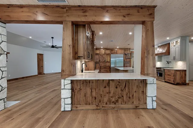 a kitchen with a sink and cabinets