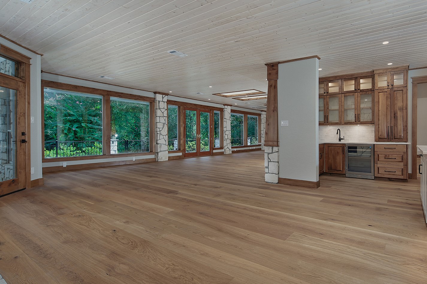 26442 McDonald Road Spring, TX 77380 - Photo 18 of 43 a view of an empty room with wooden floor and a window