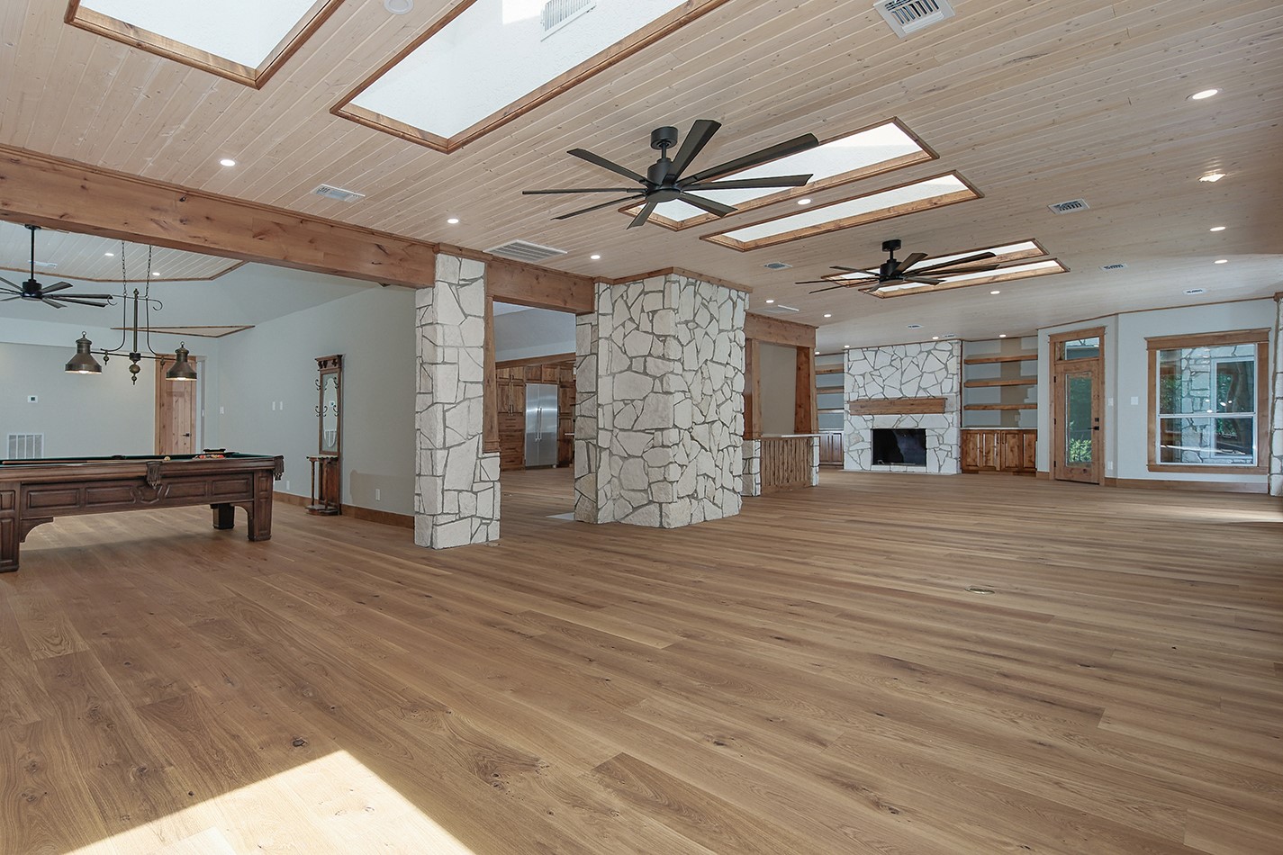 26442 McDonald Road Spring, TX 77380 - Photo 21 of 43 a view of an empty room with a fireplace and a ceiling fan