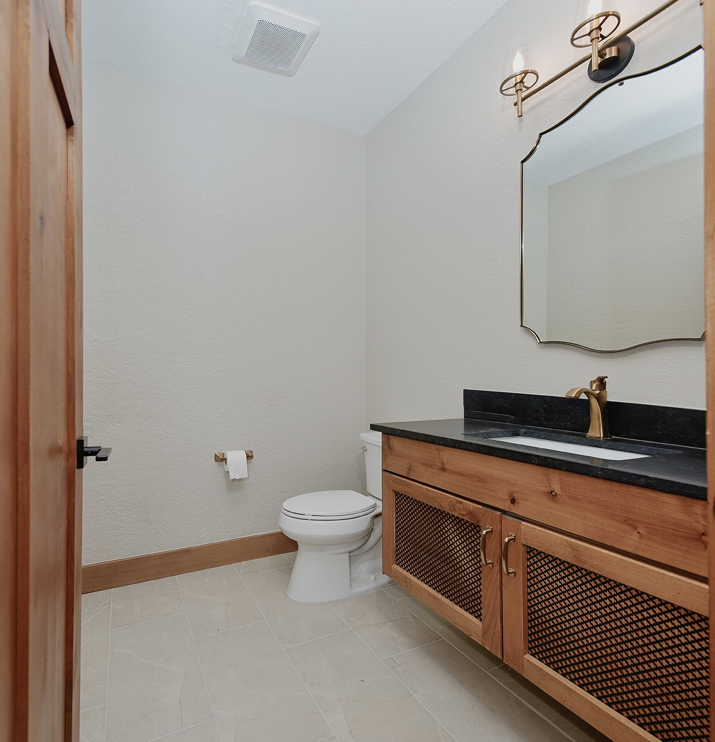 26442 McDonald Road Spring, TX 77380 - Photo 25 of 43 a bathroom with a sink a toilet and mirror