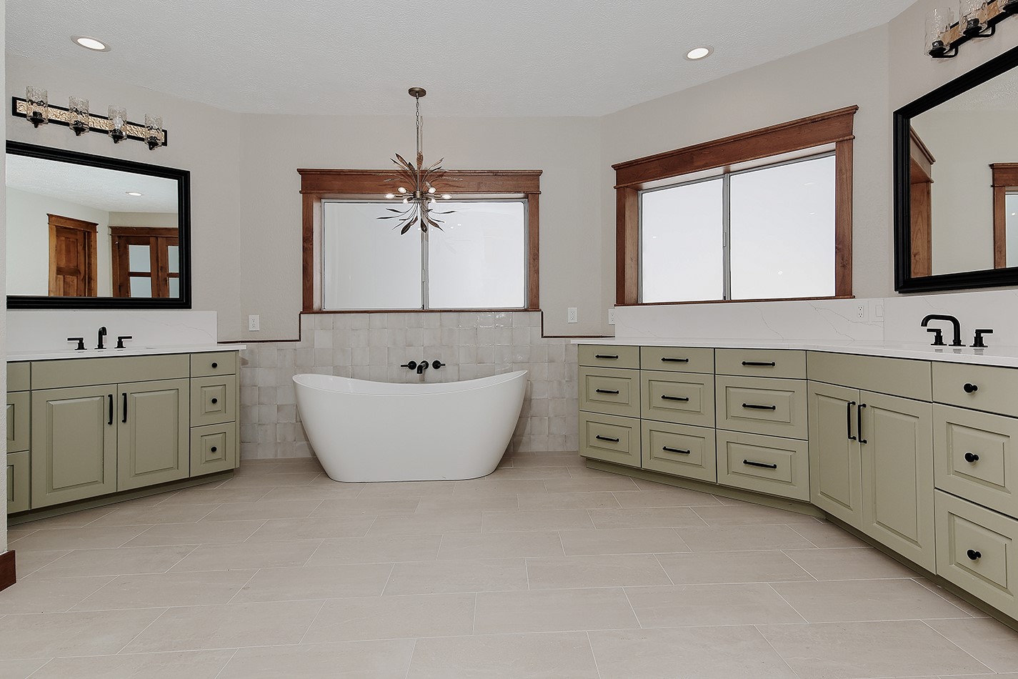 26442 McDonald Road Spring, TX 77380 - Photo 29 of 43 a spacious bathroom with double vanity sink a mirror a bathtub and window