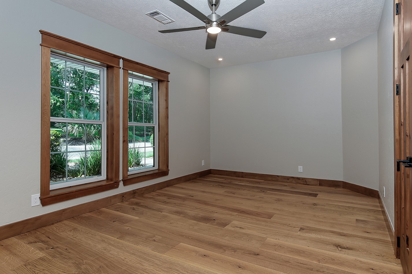 26442 McDonald Road Spring, TX 77380 - Photo 33 of 43 a view of an empty room with a window and wooden floor