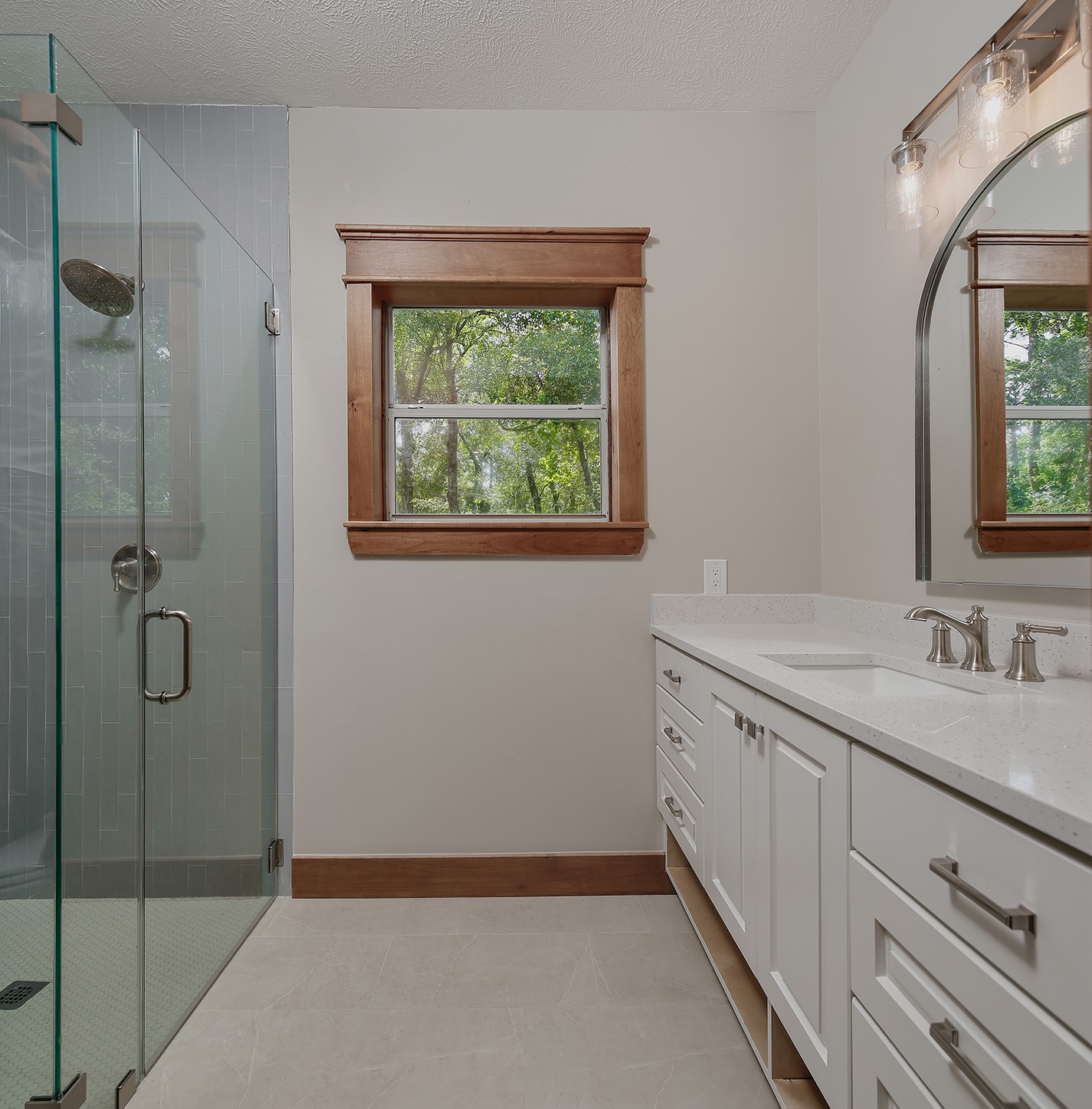26442 McDonald Road Spring, TX 77380 - Photo 37 of 43 a bathroom with a granite countertop sink mirror and shower