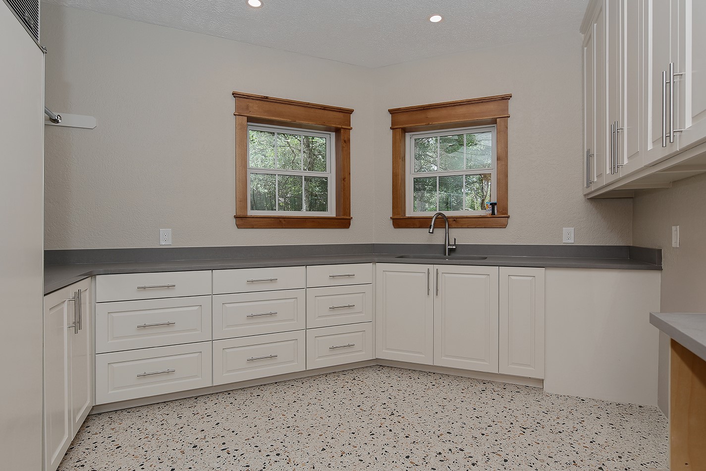 26442 McDonald Road Spring, TX 77380 - Photo 39 of 43 a kitchen with stainless steel appliances granite countertop white cabinets and window