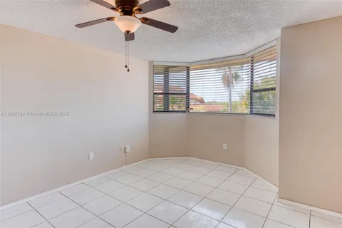 a view of bathroom with a sink and mirror