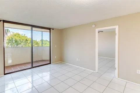 a view of a chandelier fan and entryway