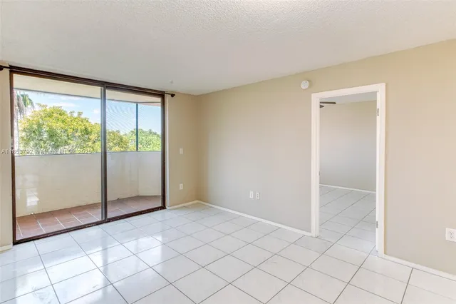 a view of a chandelier fan and entryway