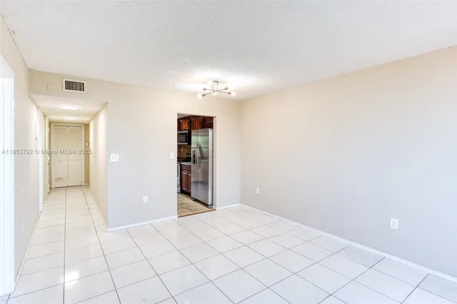 a kitchen with granite countertop a sink stove and cabinets
