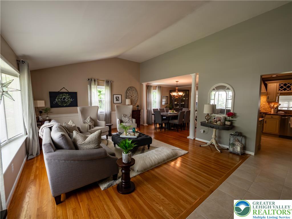 2087 Hopewell Road Bethlehem, PA 18017 - Photo 7 of 38 Rich hardwood floors unite the living and dining areas, creating an inviting, open flow.