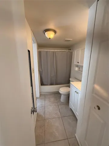 a bathroom with a sink a toilet and a shower