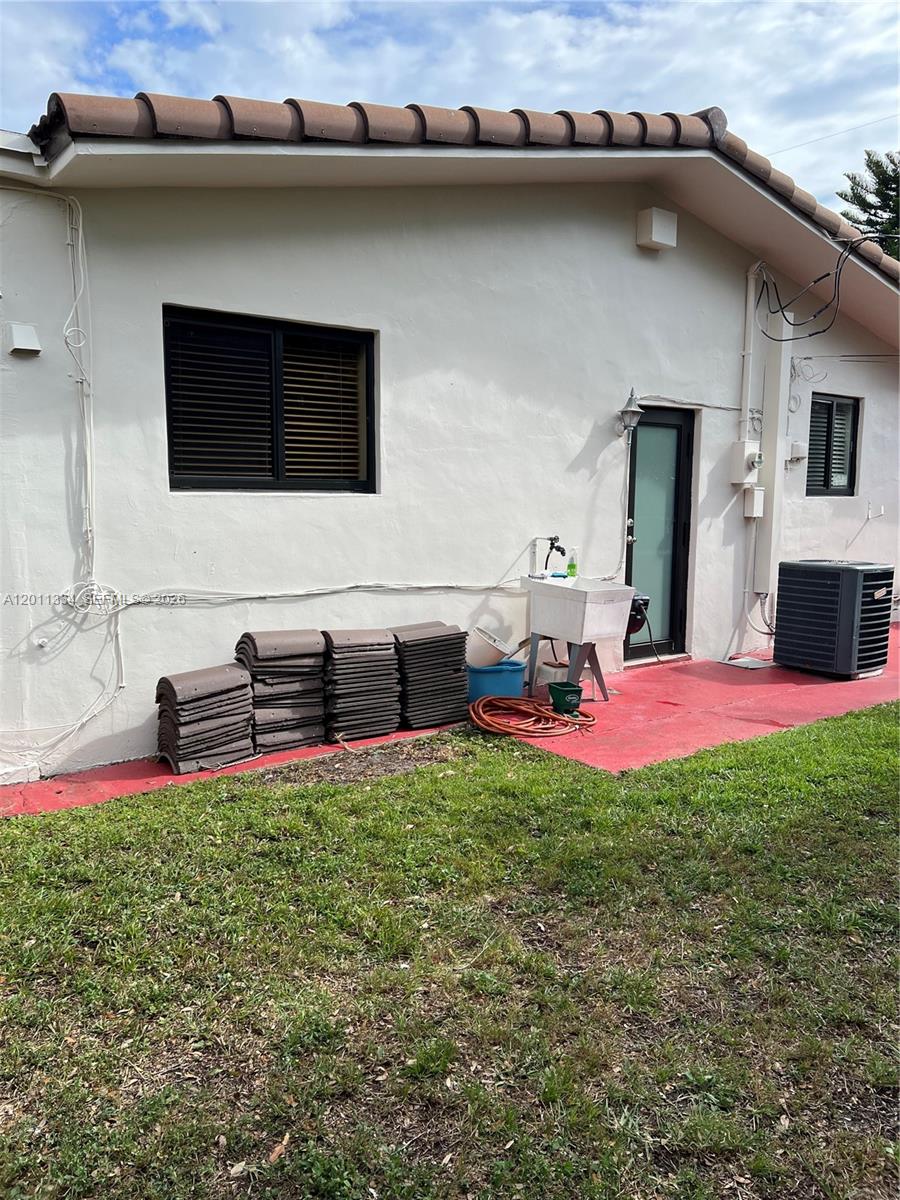 6385 Southwest 25th Street Miami, FL 33155 - Photo 22 of 28 a view of front of house with a yard