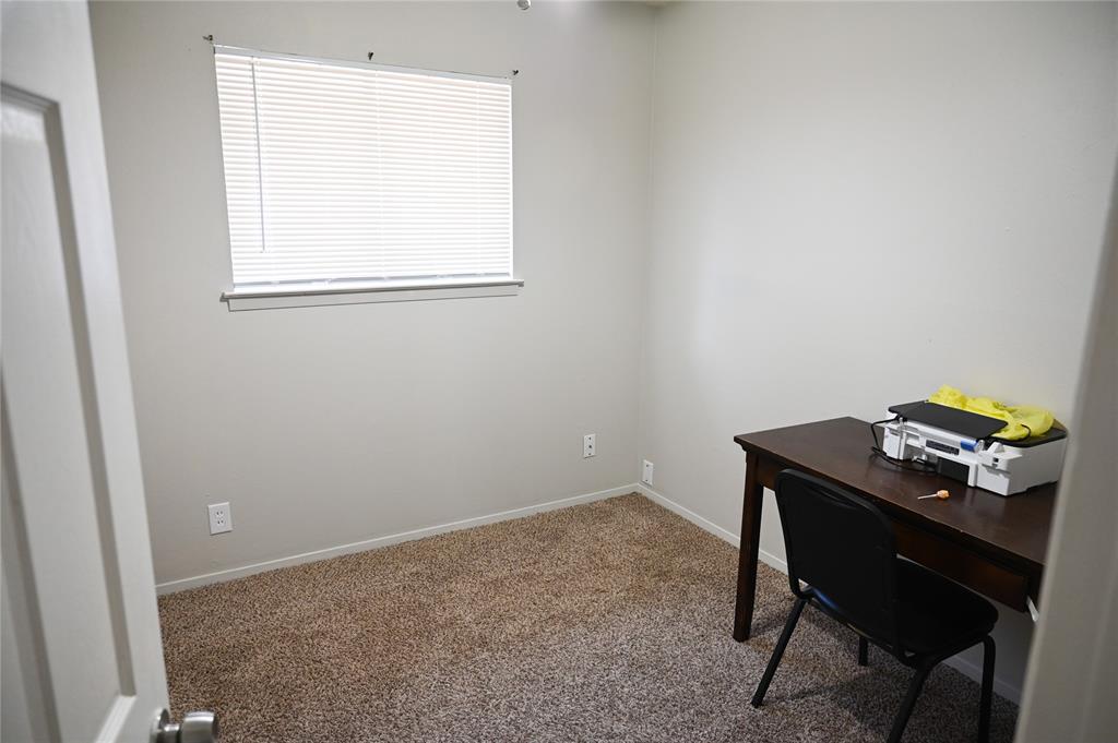 1352 Simpson Drive Hurst, TX 76053 - Photo 13 of 40 Neutral-toned walls complement the textured carpet flooring