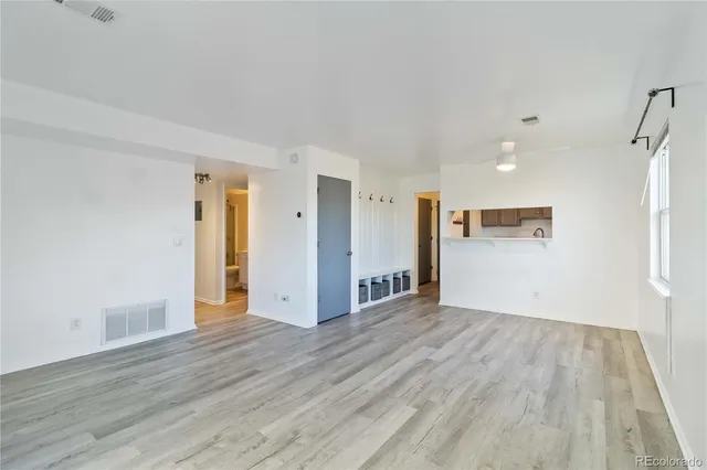 a view of a livingroom with wooden floor