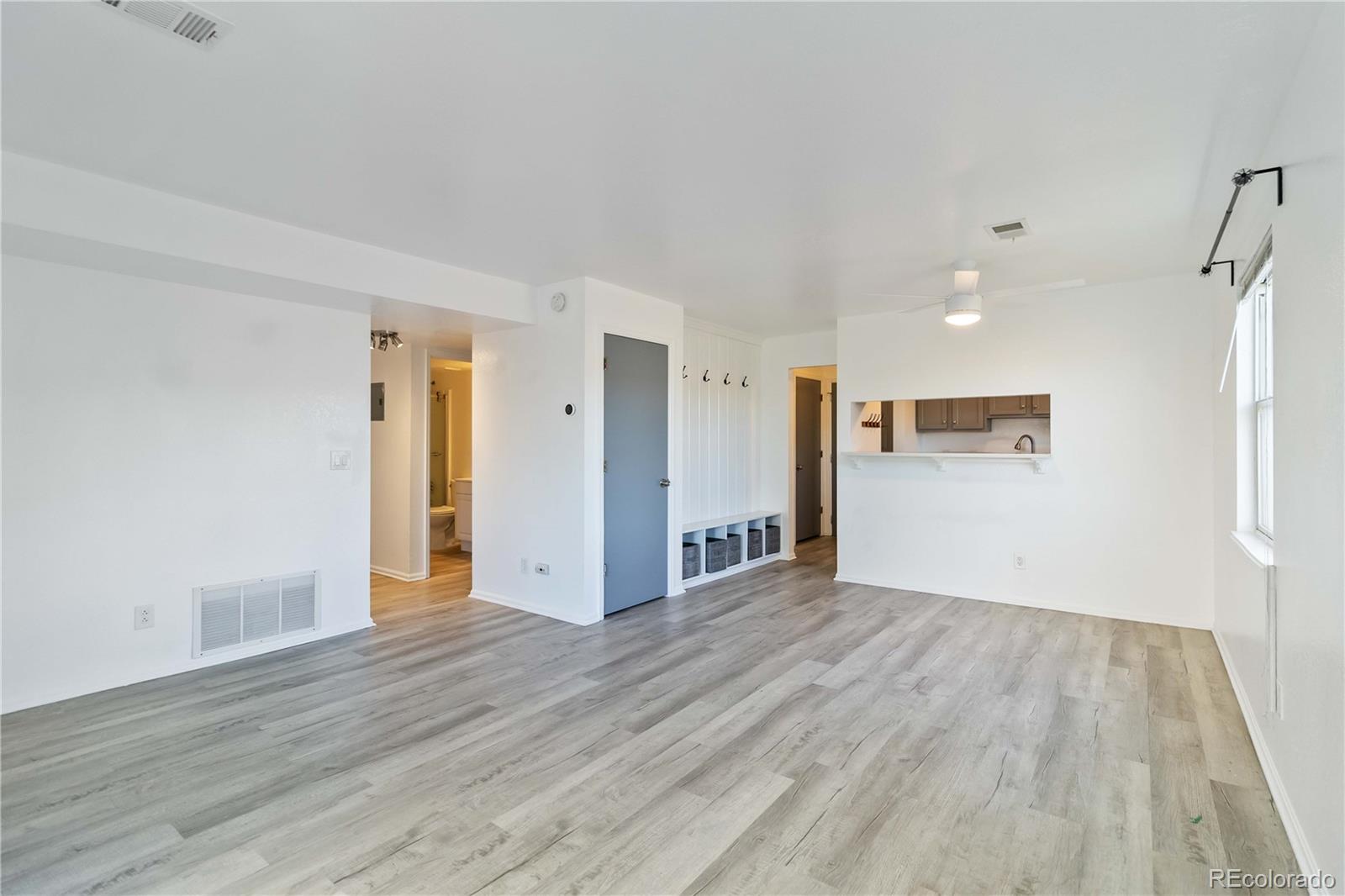 1263 South Gilbert Street, Unit B201 Castle Rock, CO 80104 - Photo 11 of 25 a view of a livingroom with wooden floor