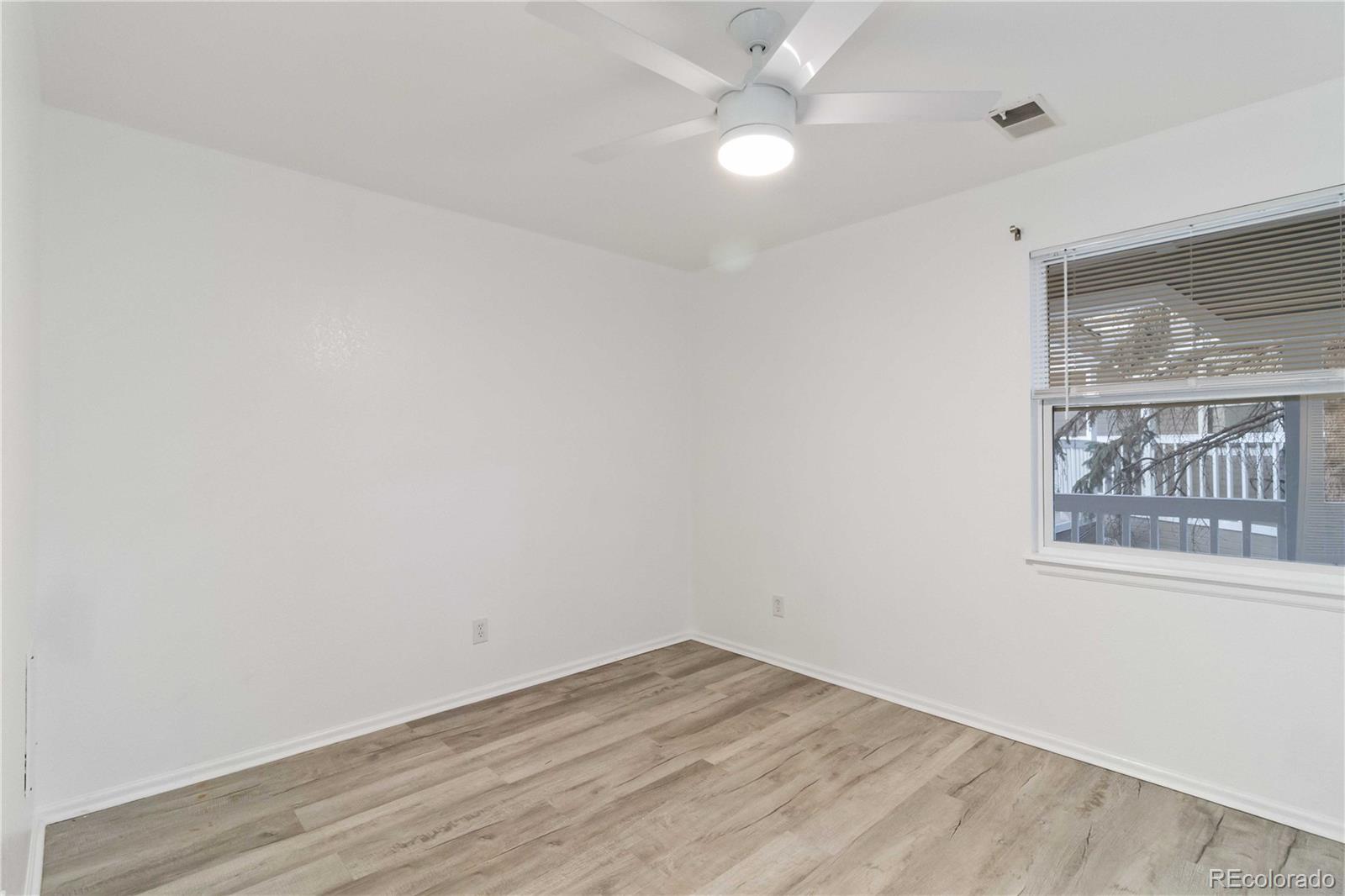 1263 South Gilbert Street, Unit B201 Castle Rock, CO 80104 - Photo 16 of 25 an empty room with a window and a fan