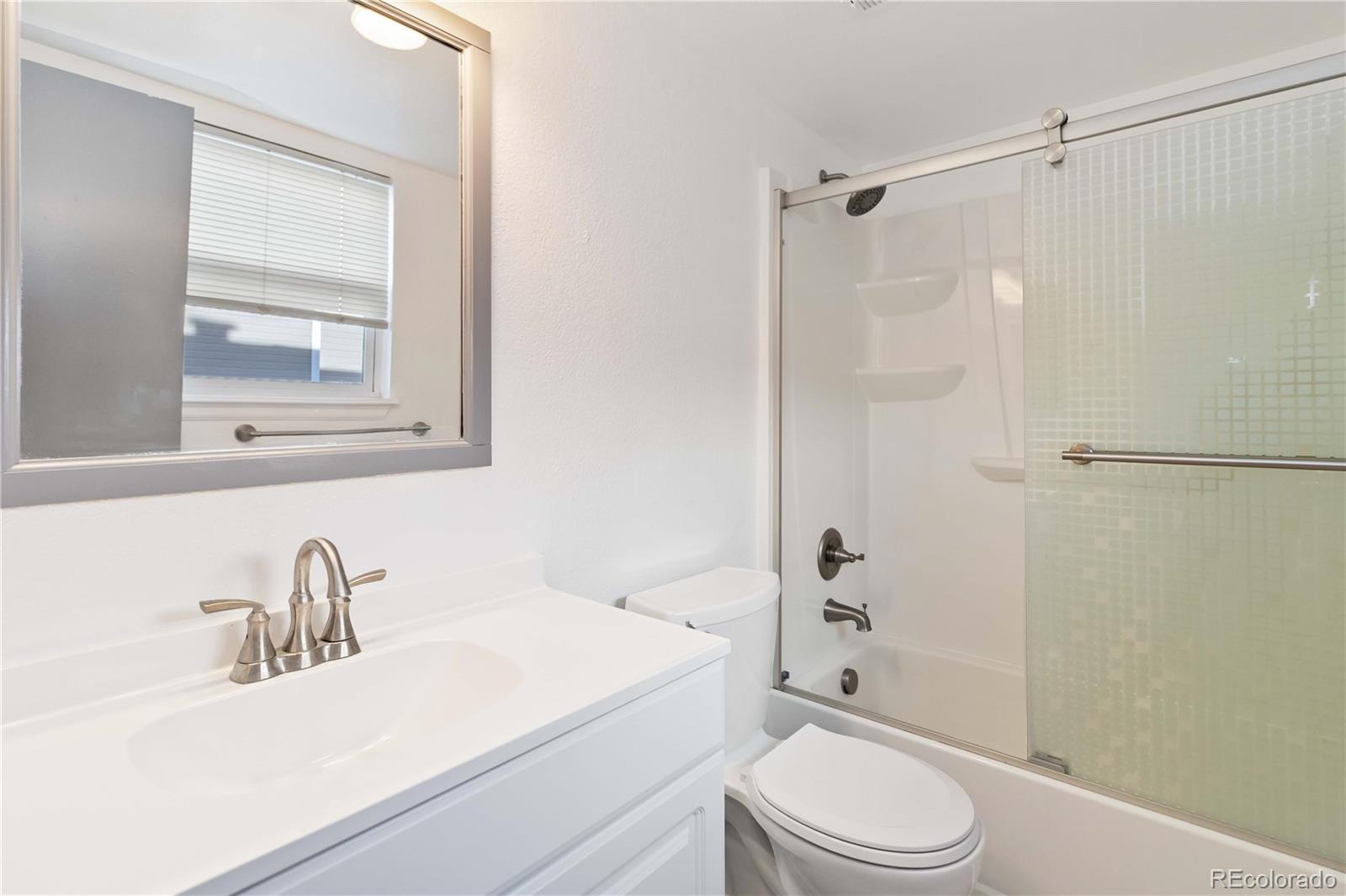 1263 South Gilbert Street, Unit B201 Castle Rock, CO 80104 - Photo 22 of 25 a bathroom with a sink toilet and shower