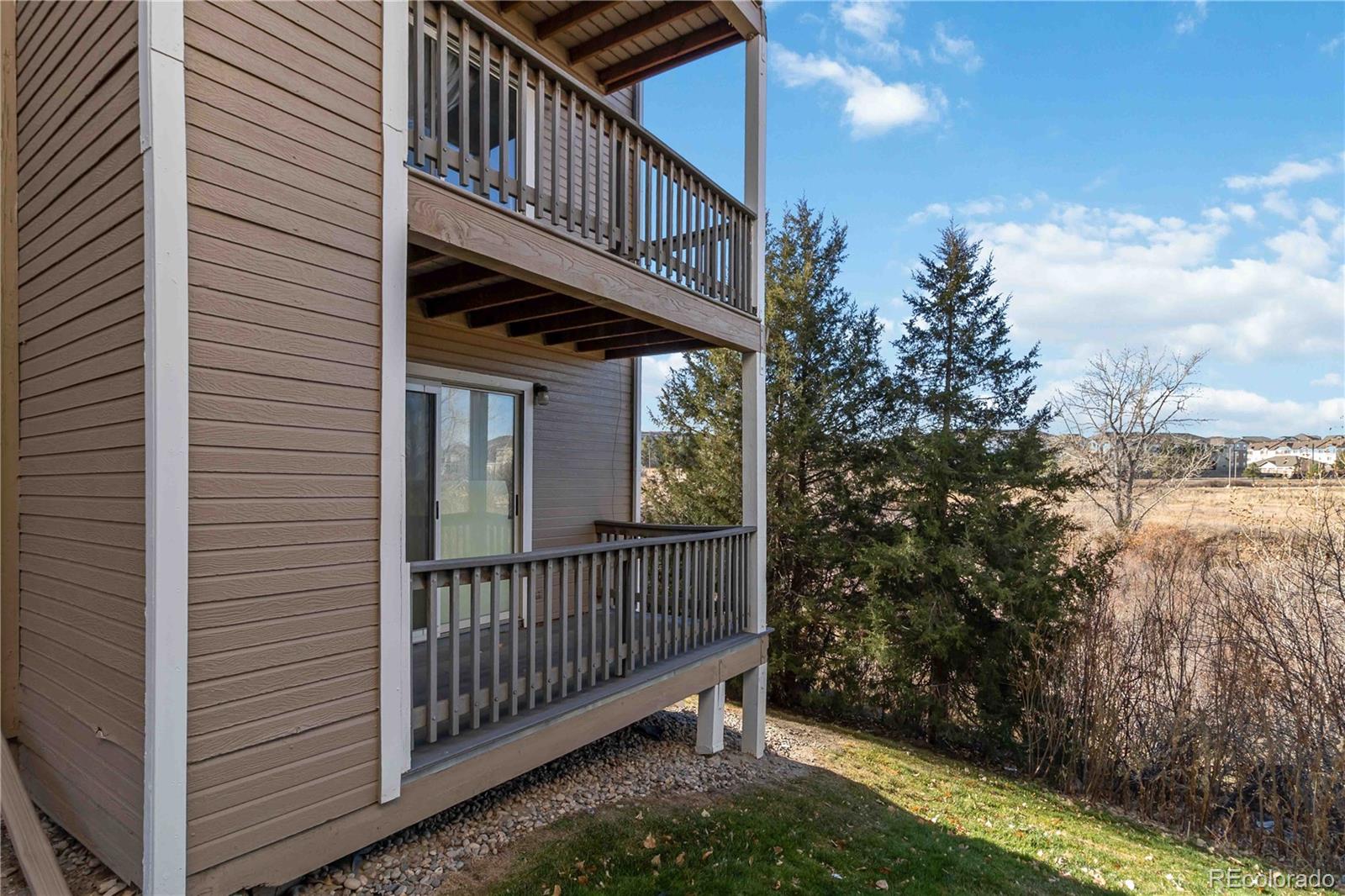 1263 South Gilbert Street, Unit B201 Castle Rock, CO 80104 - Photo 25 of 25 a view of a house with backyard and deck