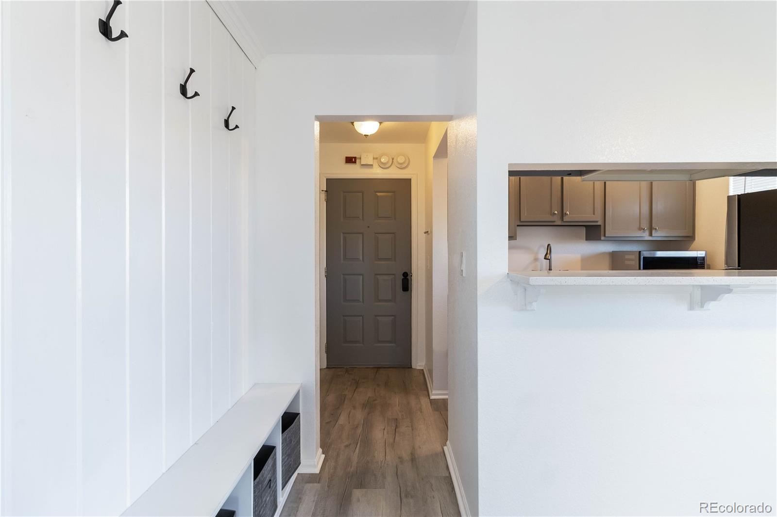 1263 South Gilbert Street, Unit B201 Castle Rock, CO 80104 - Photo 3 of 25 a view of a kitchen from the hallway