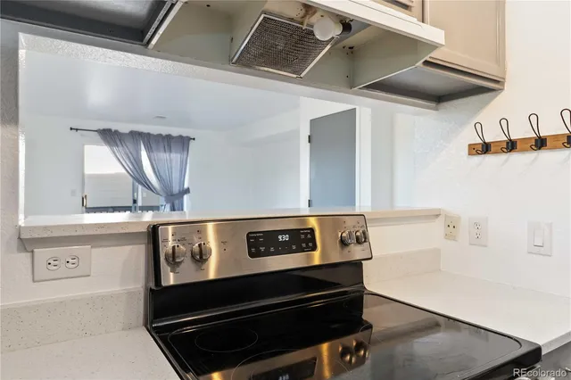a view of kitchen with wooden floor and a sink