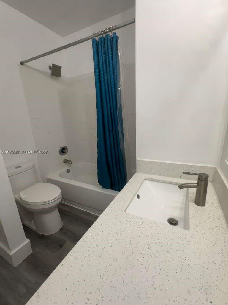 15330 Southwest 106th Terrace, Unit 915 Miami, FL 33196 - Photo 3 of 8 a bathroom with a toilet and shower