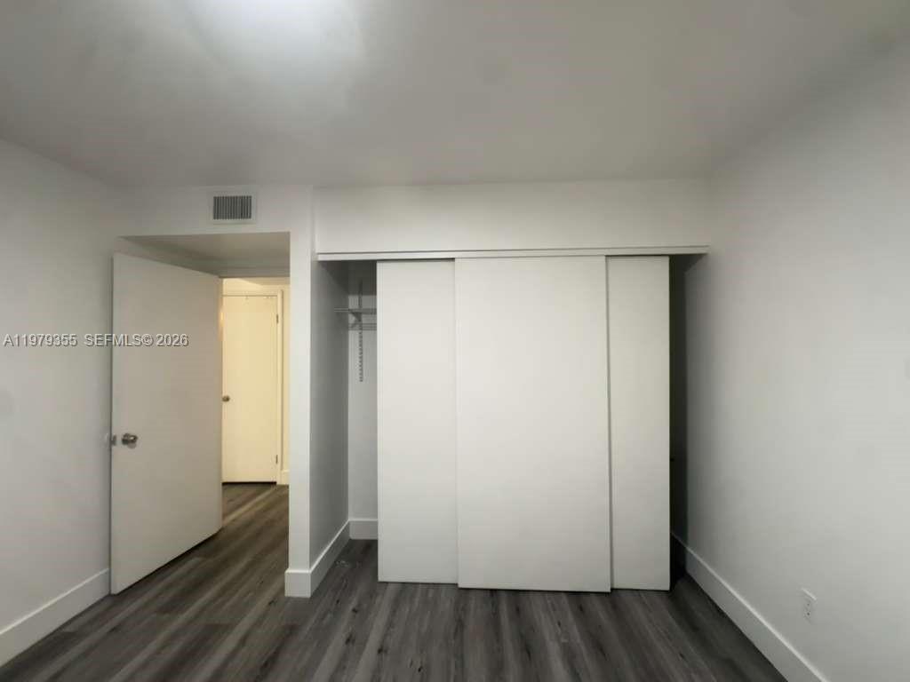 15330 Southwest 106th Terrace, Unit 915 Miami, FL 33196 - Photo 6 of 8 a view of small space with wooden floor