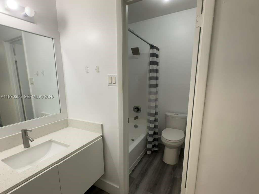 15330 Southwest 106th Terrace, Unit 915 Miami, FL 33196 - Photo 7 of 8 a bathroom with a sink a toilet and shower
