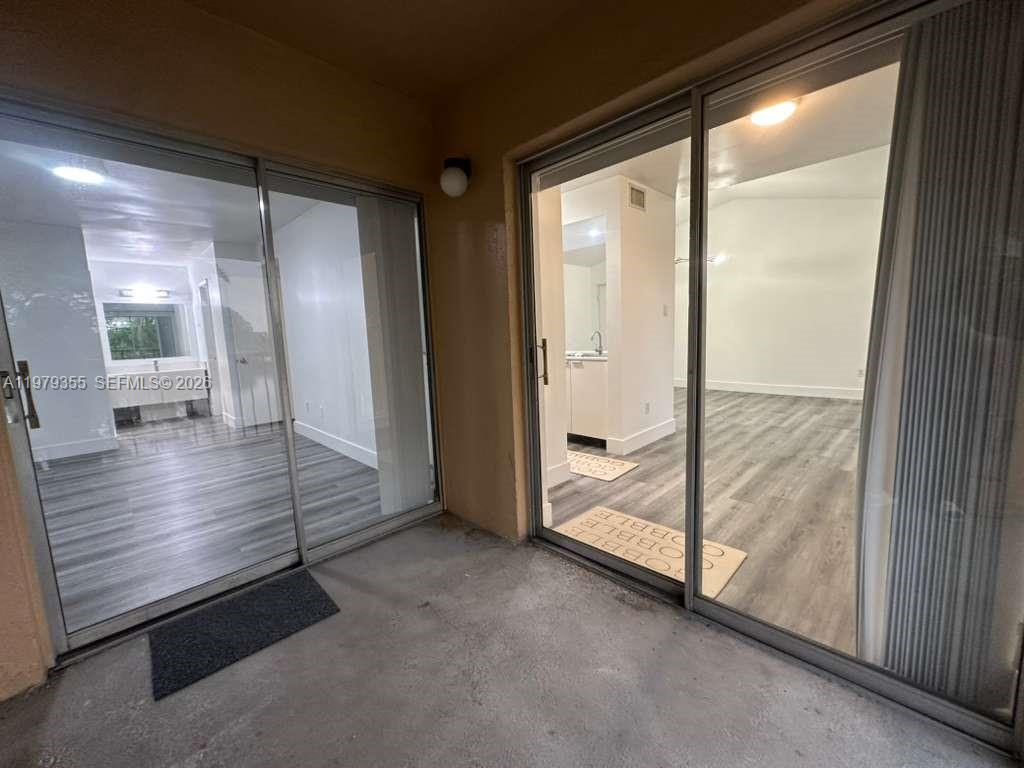 15330 Southwest 106th Terrace, Unit 915 Miami, FL 33196 - Photo 8 of 8 a view of empty room with wooden floor