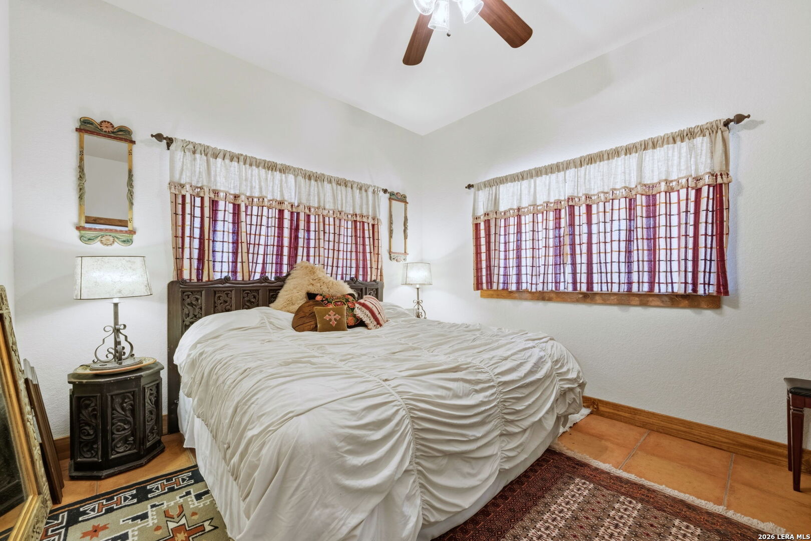 1150 Bruce Road Poteet, TX 78065 - Photo 25 of 33 a bedroom with a bed and a window