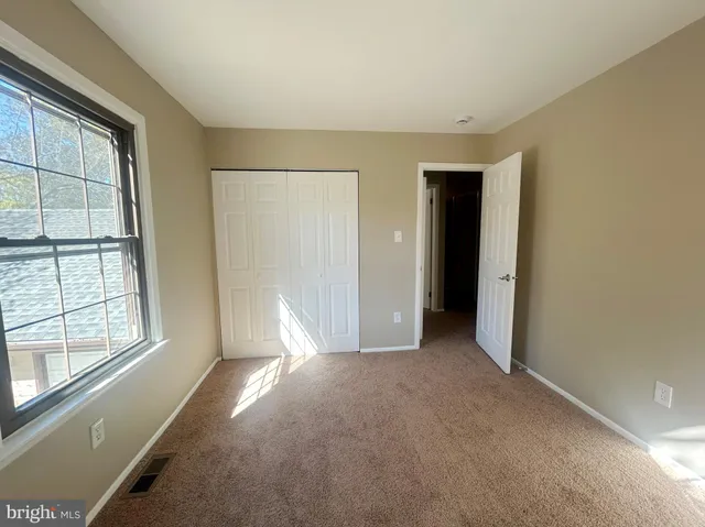 a view of empty room with windows