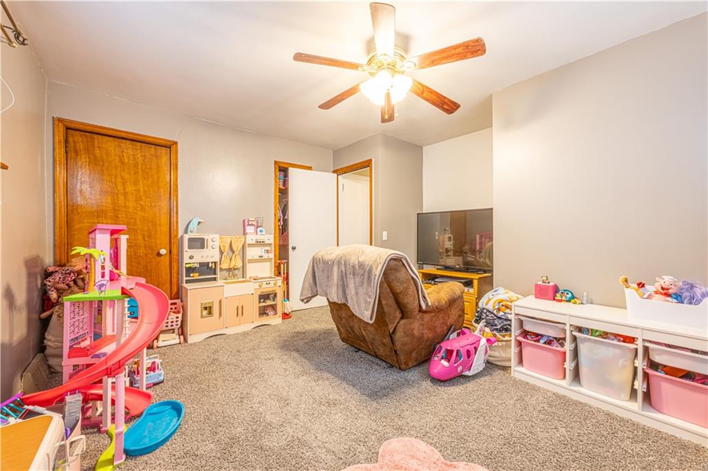 210 Stone Church Road Grindstone, PA 15442 - Photo 11 of 18 a bedroom with furniture and a flat screen tv