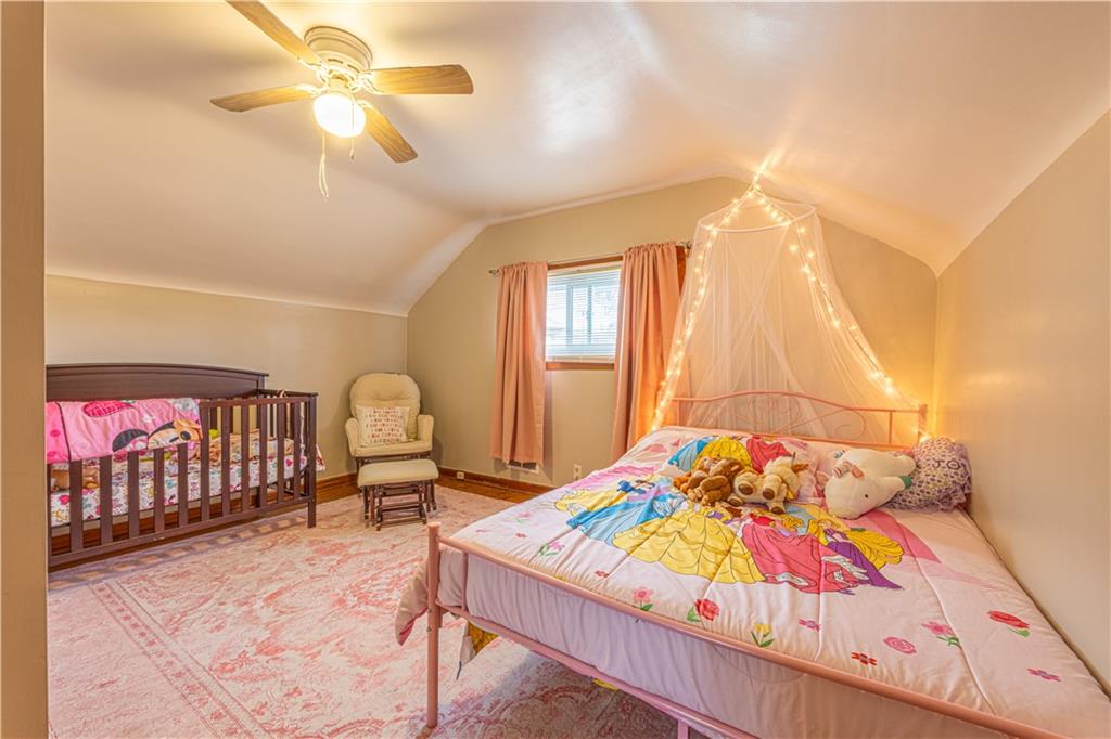 210 Stone Church Road Grindstone, PA 15442 - Photo 14 of 18 a bedroom with a bed and a chandelier