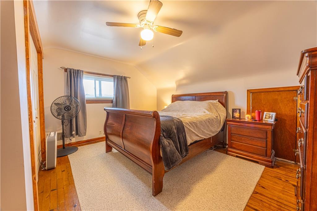 210 Stone Church Road Grindstone, PA 15442 - Photo 15 of 18 a bedroom with a bed couch and dresser