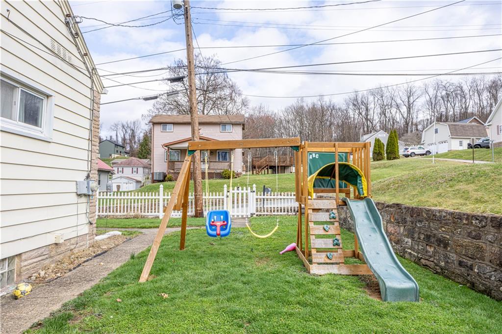210 Stone Church Road Grindstone, PA 15442 - Photo 16 of 18 a view of a yard with a slide and a table