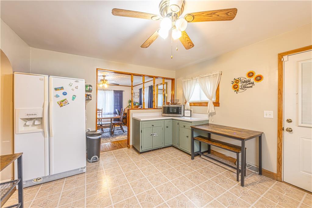 210 Stone Church Road Grindstone, PA 15442 - Photo 5 of 18 a kitchen with a refrigerator and countertop