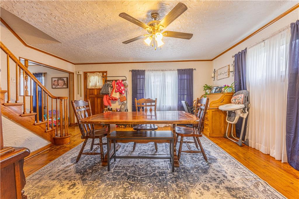 210 Stone Church Road Grindstone, PA 15442 - Photo 6 of 18 a view of a dining room with furniture window and wooden floor