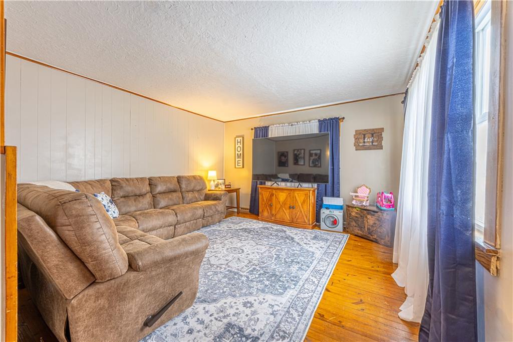 210 Stone Church Road Grindstone, PA 15442 - Photo 8 of 18 a living room with furniture and a couch