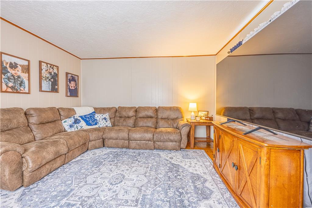 210 Stone Church Road Grindstone, PA 15442 - Photo 9 of 18 a bedroom with a bed and a couch