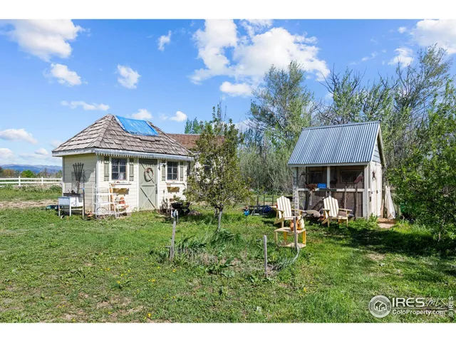 a front view of house with a garden